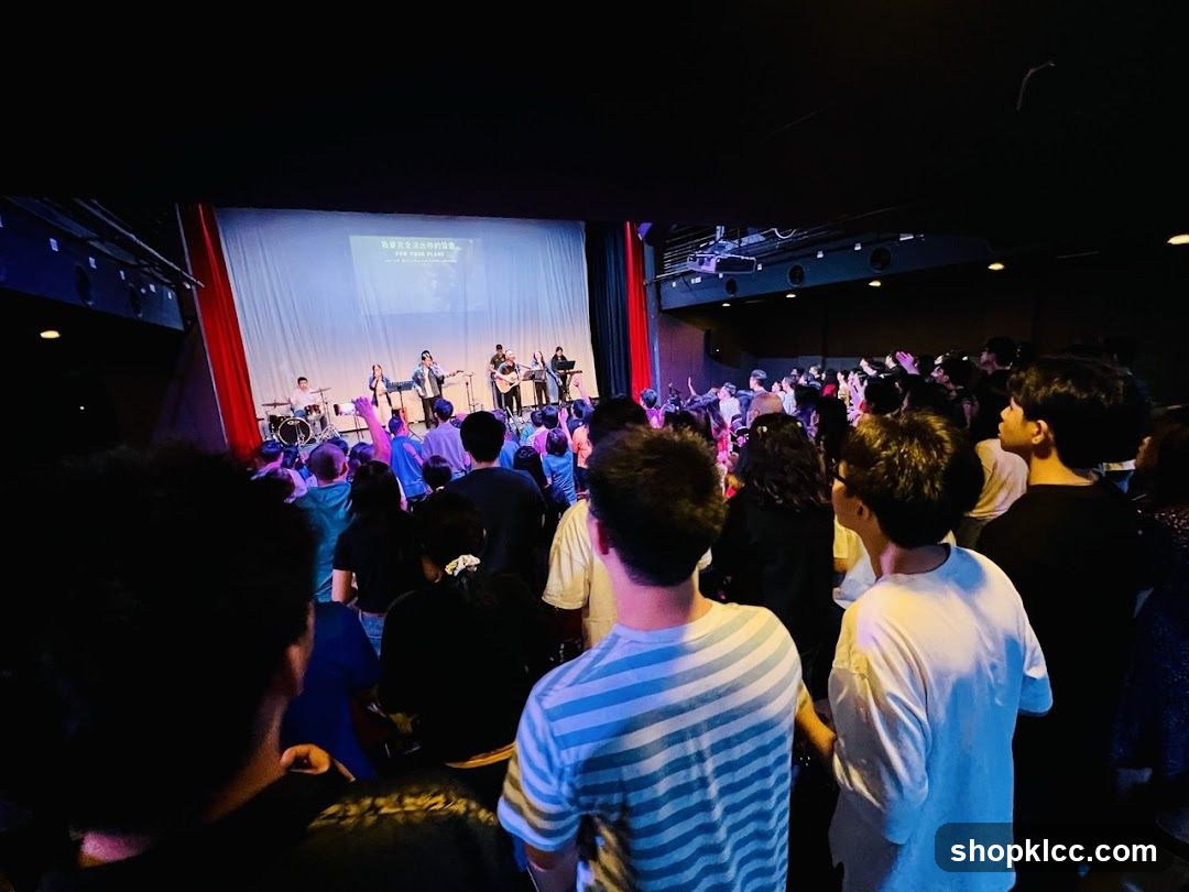 Congregation watching a band perform on stage