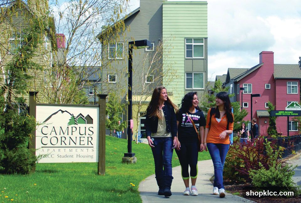Students walking past Campus Corner Apartments