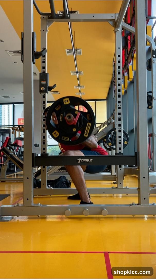Man performing a barbell squat