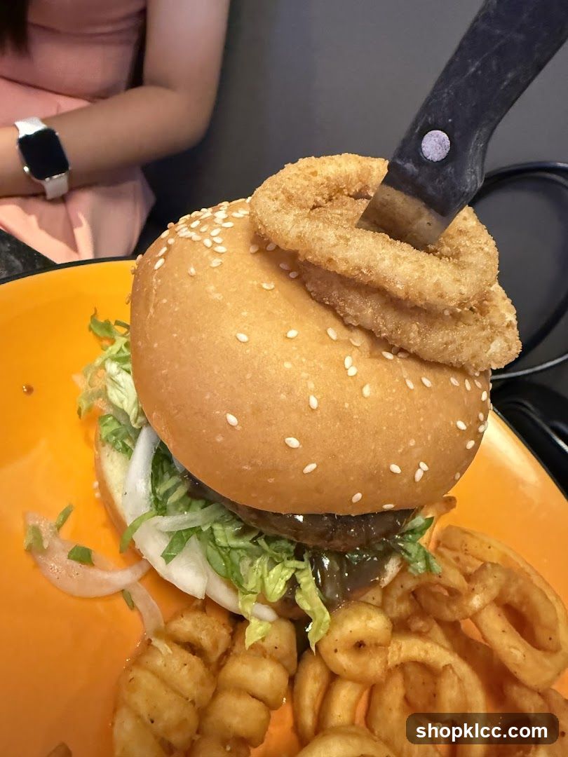 Burger with Onion Rings and Curly Fries
