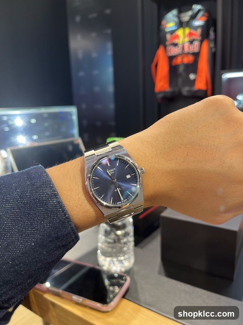 Watch on wrist with Red Bull jacket in background