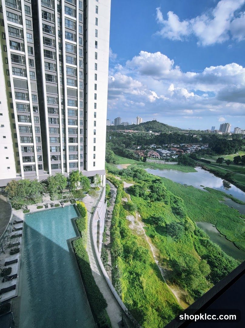 High-rise view with pool and greenery