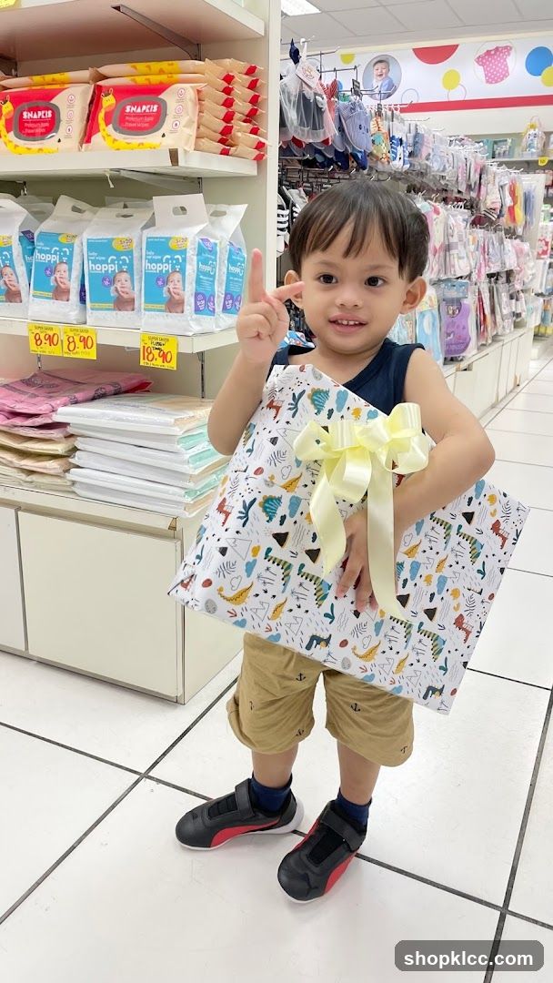 Boy Holding a Gift in a Store