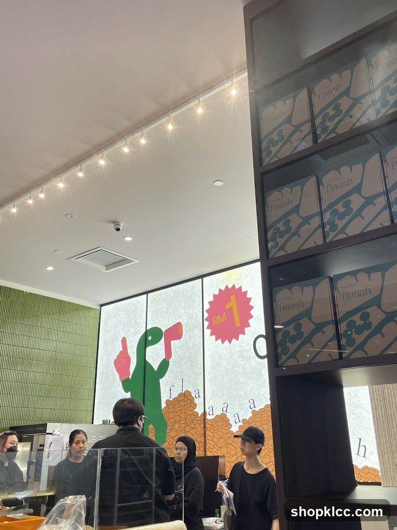 Interior of a cafe with staff and merchandise