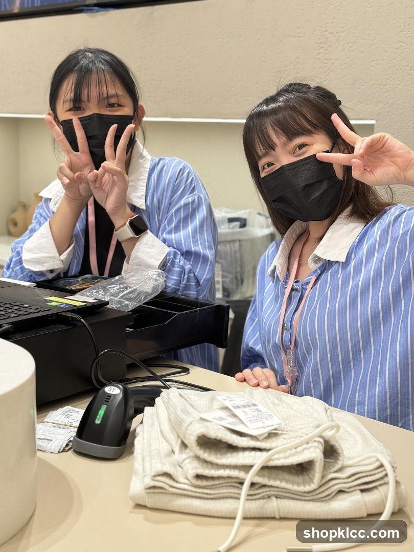 Two masked women at a checkout counter