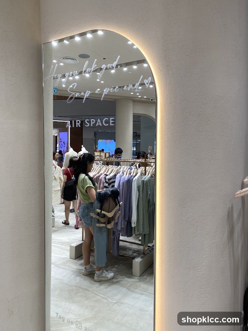 Mirror with text and clothing racks