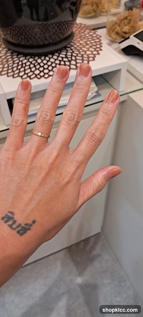 Hand with freshly painted nails
