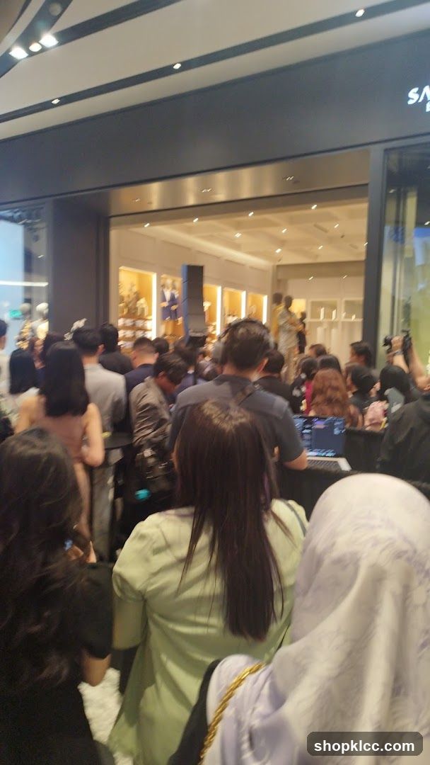 Crowd gathered in front of a store