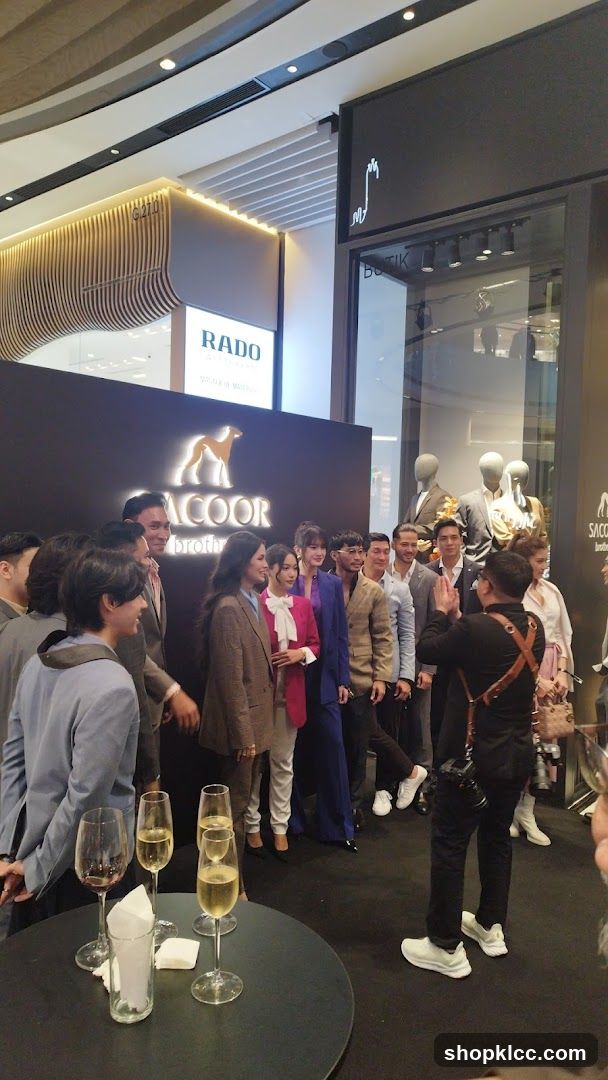Group posing for a photo at a brand event