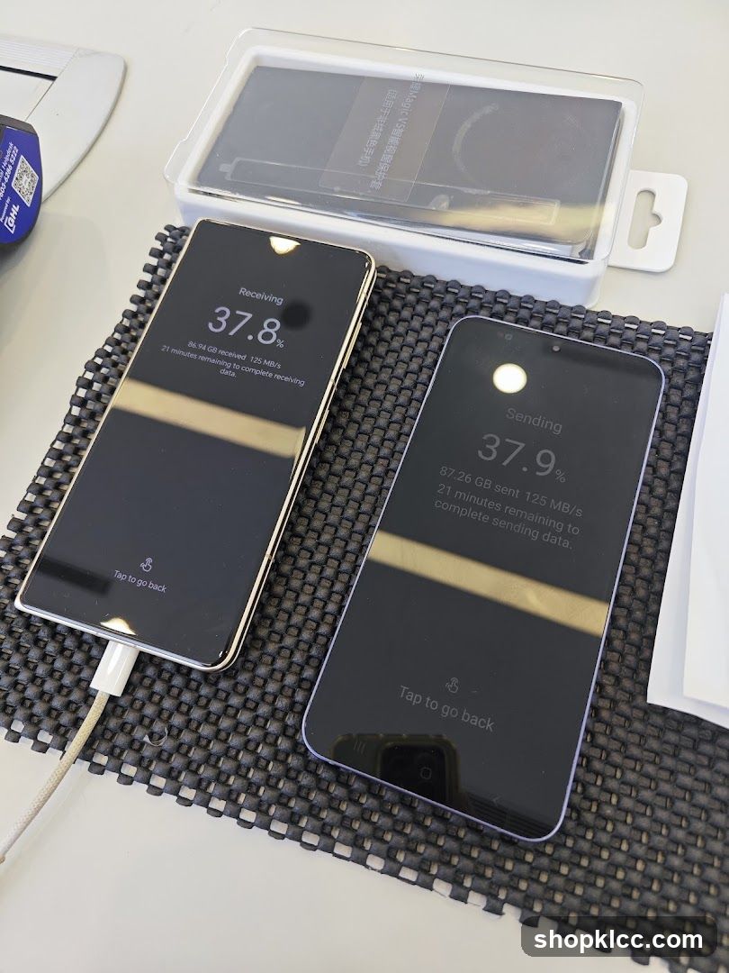Two smartphones displaying data transfer progress