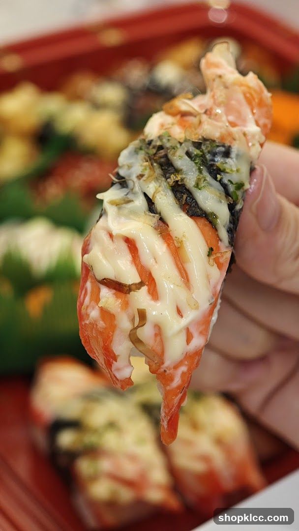 Salmon Sushi Roll with Cheese Topping