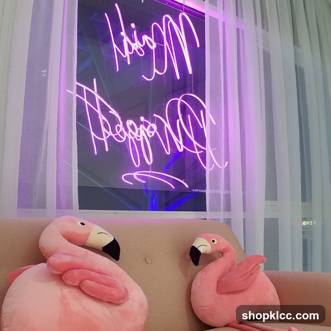 Pink flamingo plushies and neon sign