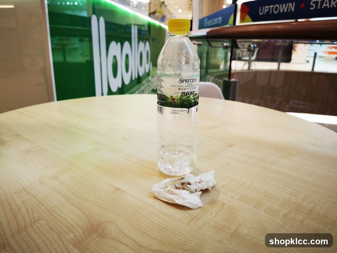 Empty water bottle on table