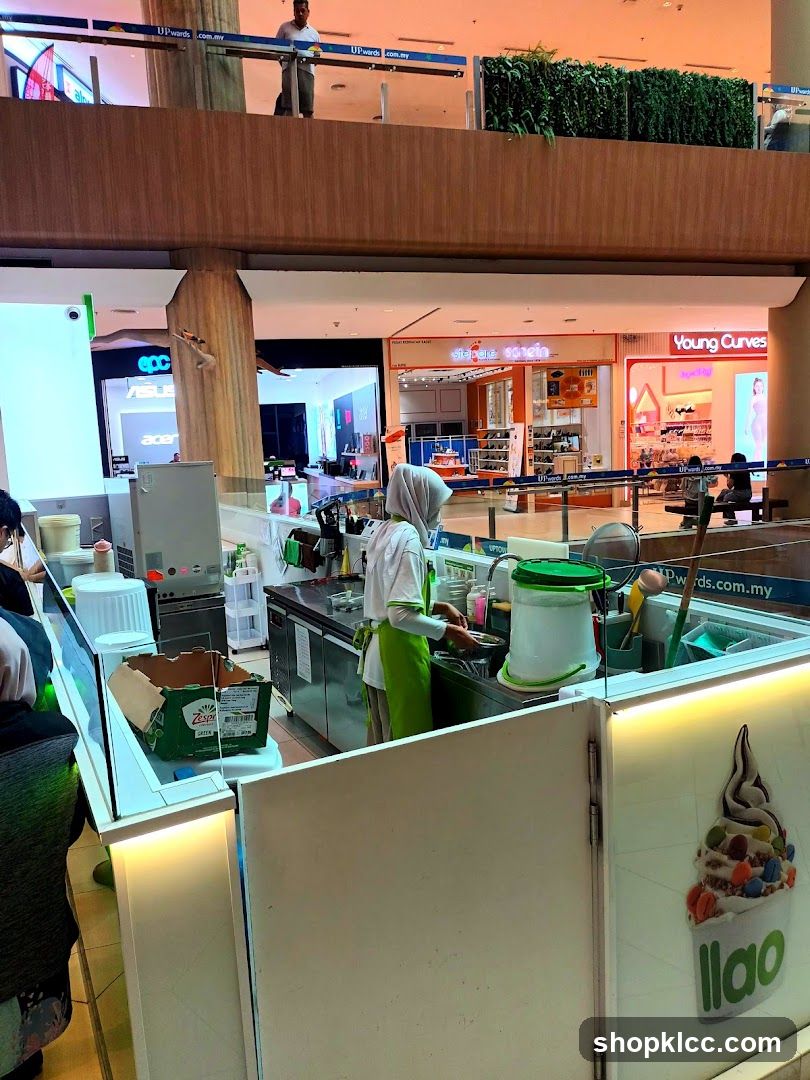 Food Stall Interior with Staff Preparing Food