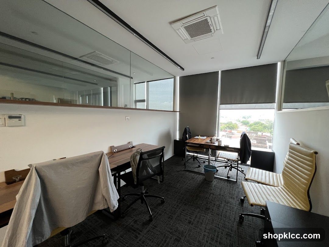 Office Interior with Glass Partition and Seating Area