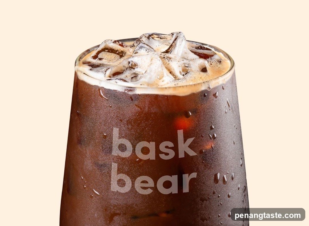 Iced beverage in branded glass