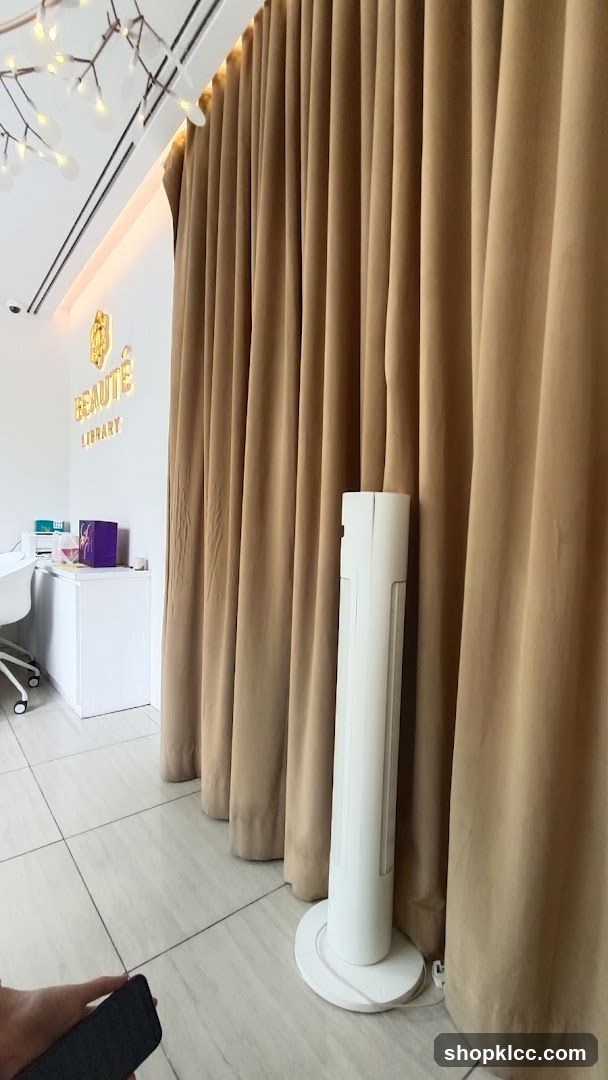 Interior of a salon with a logo and curtains