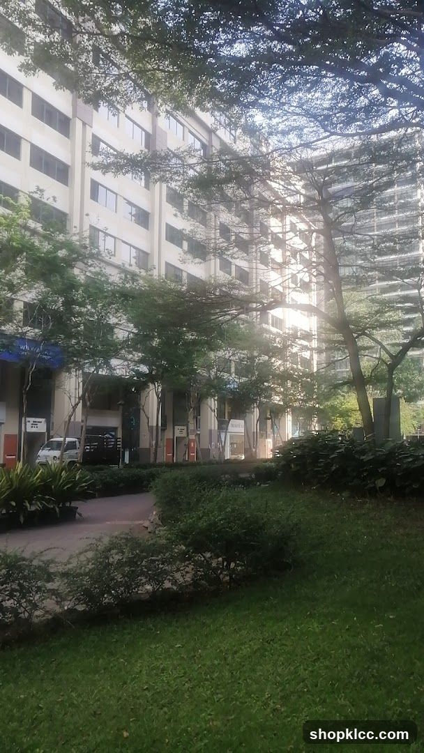 Outdoor walkway with trees and buildings