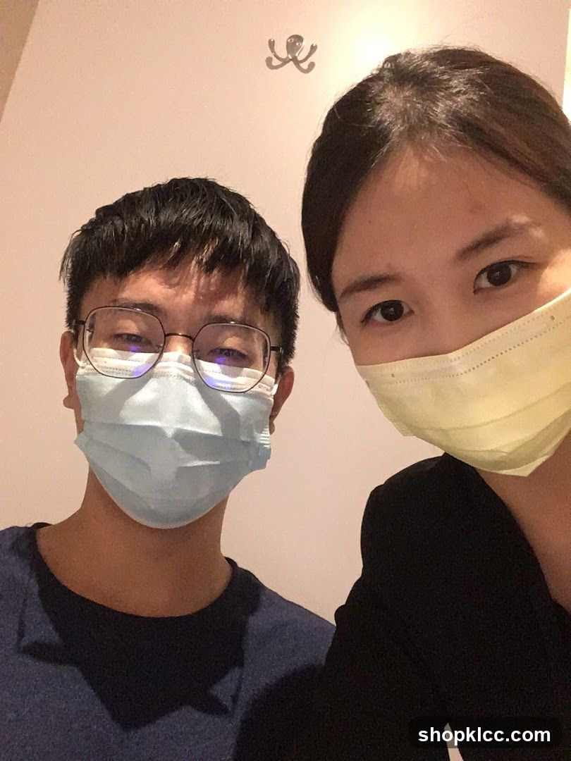 Two people wearing masks