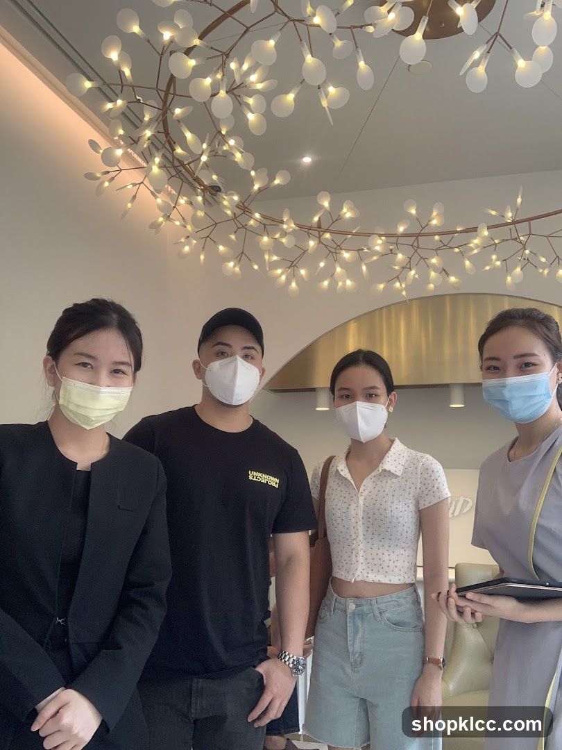 Four people wearing masks