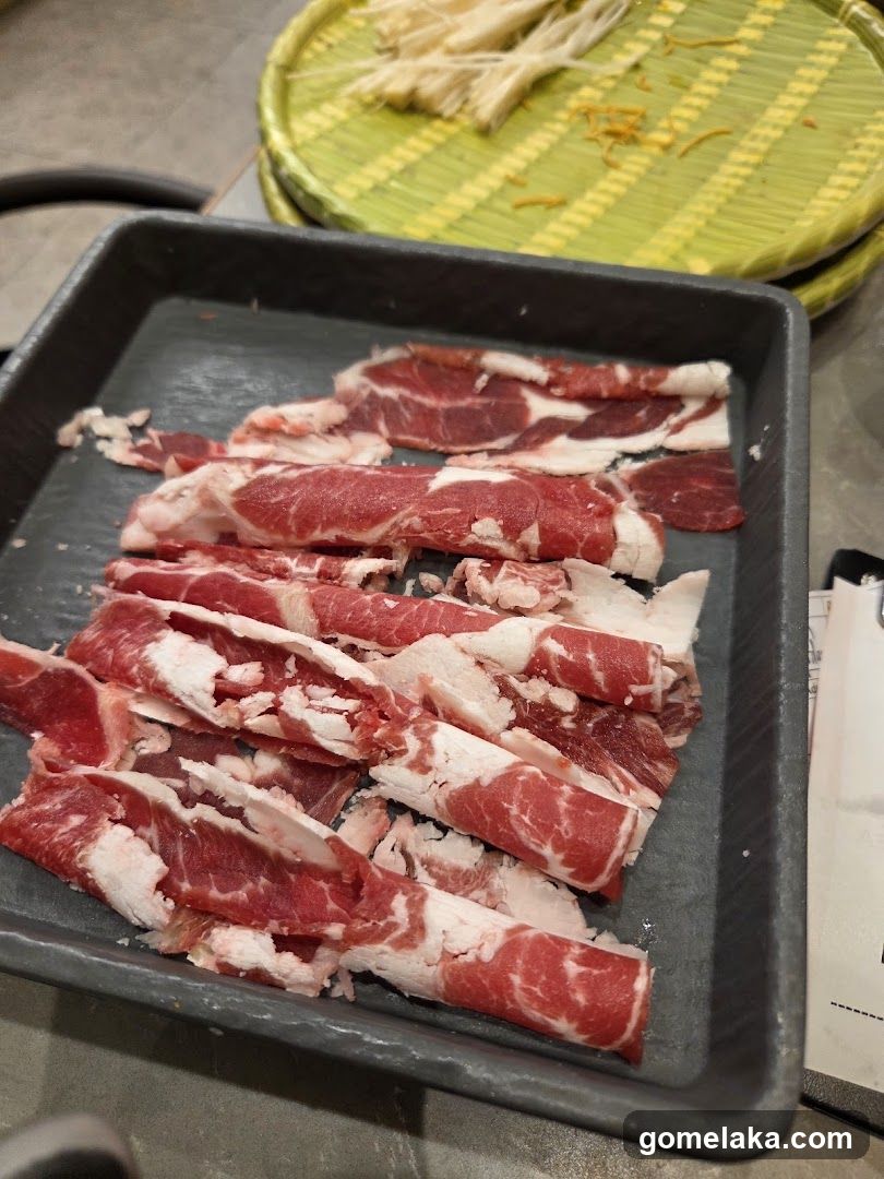 Raw meat slices on tray