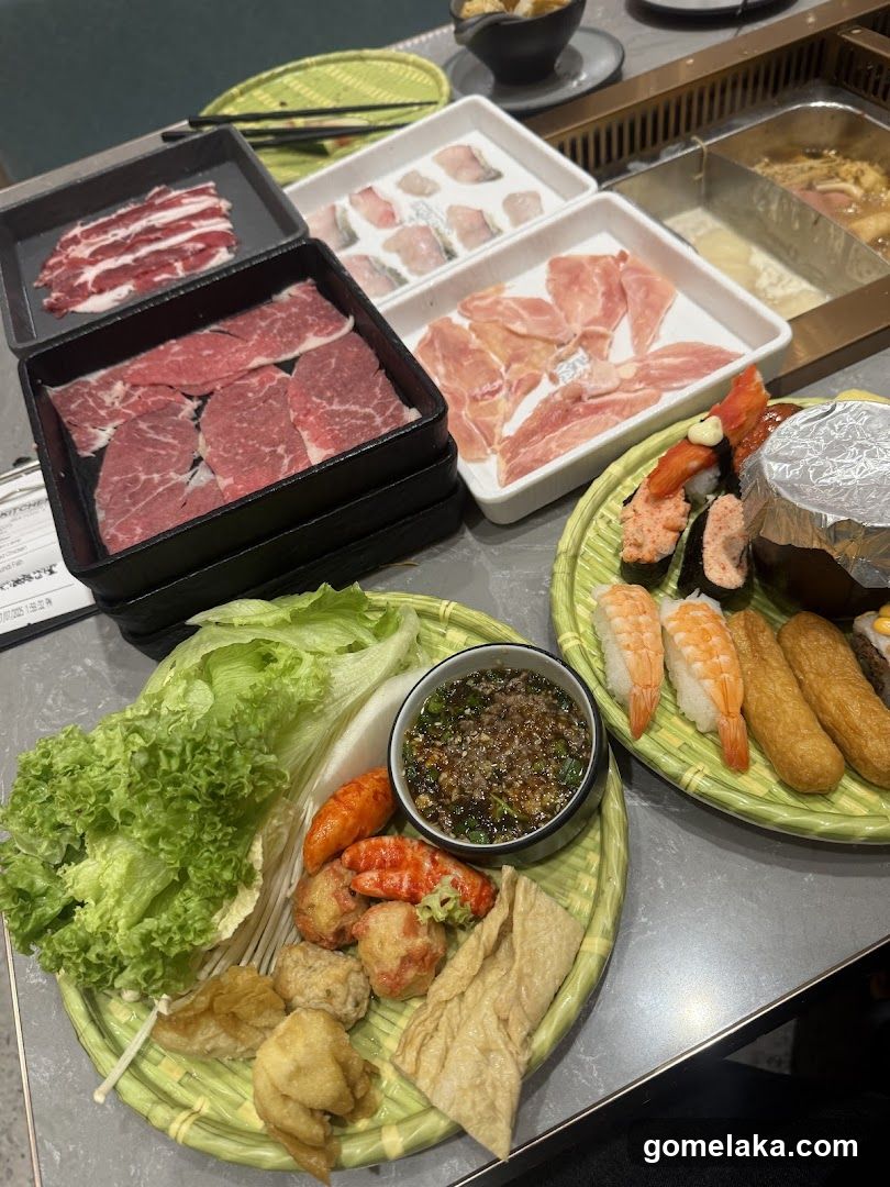 Table with hot pot and barbecue ingredients