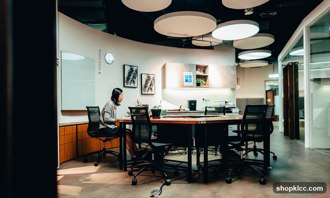 Modern Office Interior with Employee at Desk
