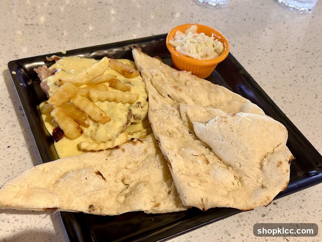 Plate of Food with Fries and Flatbread