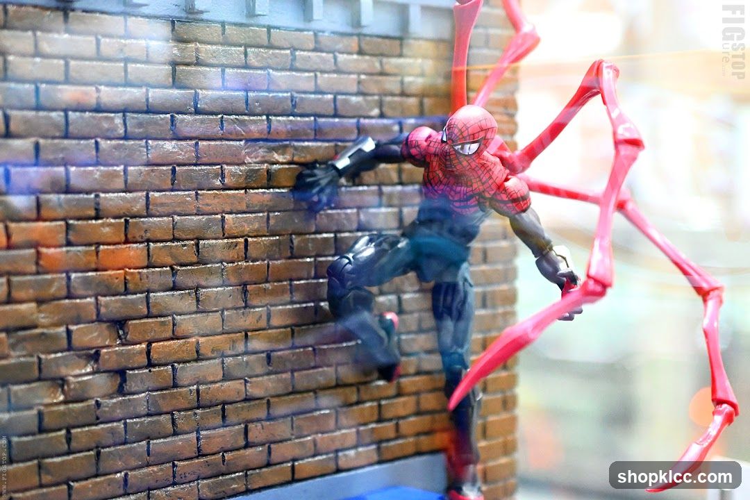 Spider-Man Action Figure on Brick Wall