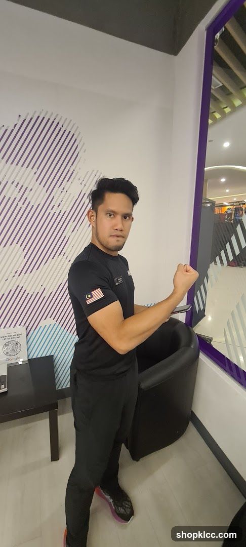 Man in gym attire posing indoors