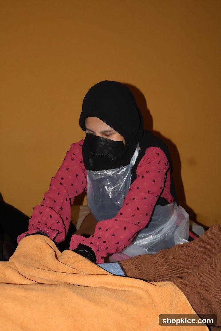 Person in hijab working indoors