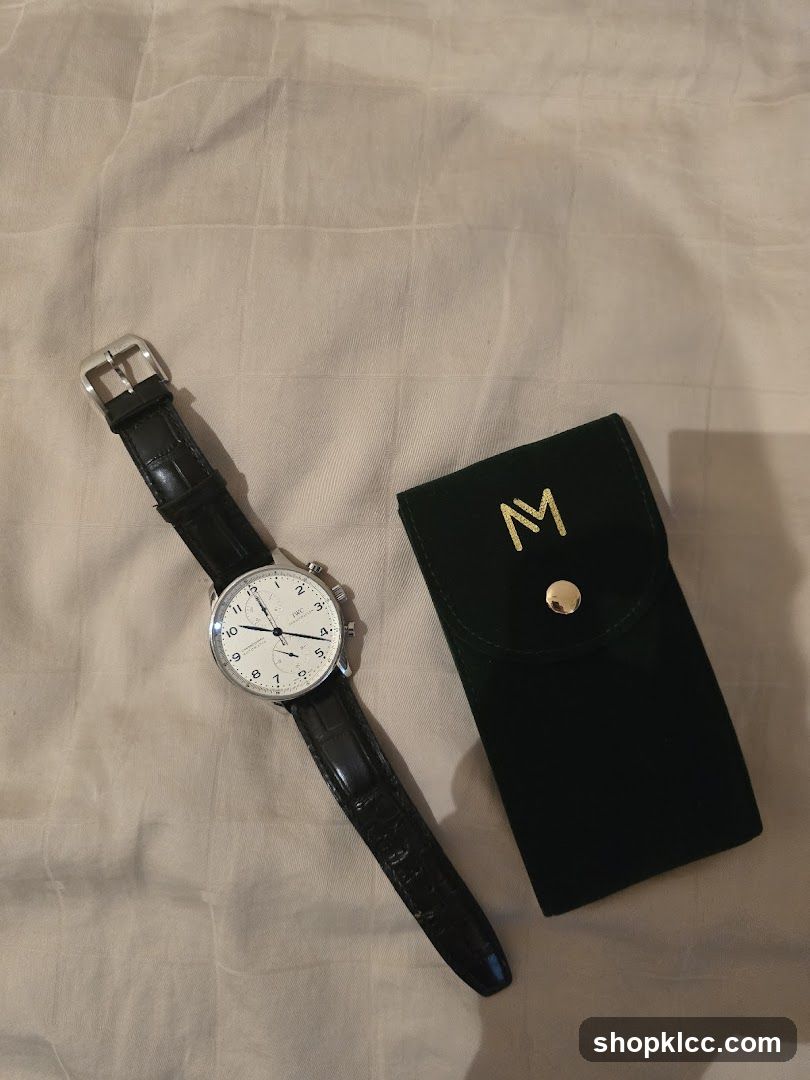 Watch and Pouch on Fabric Surface