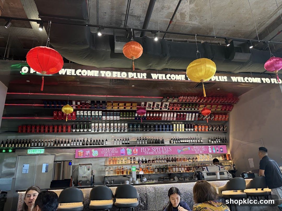Interior of a bar with colorful lanterns and shelves of bottles