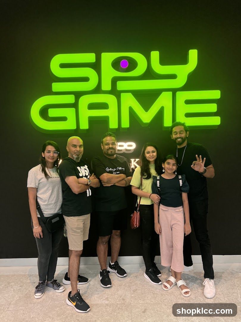 Group photo in front of Spy Game sign