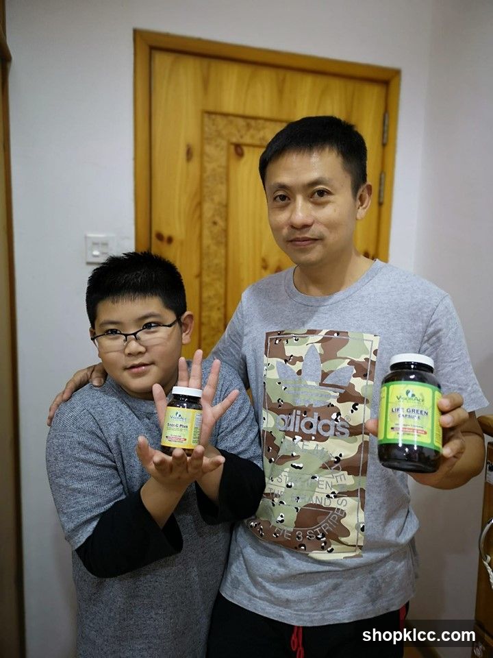 Two men holding supplement bottles