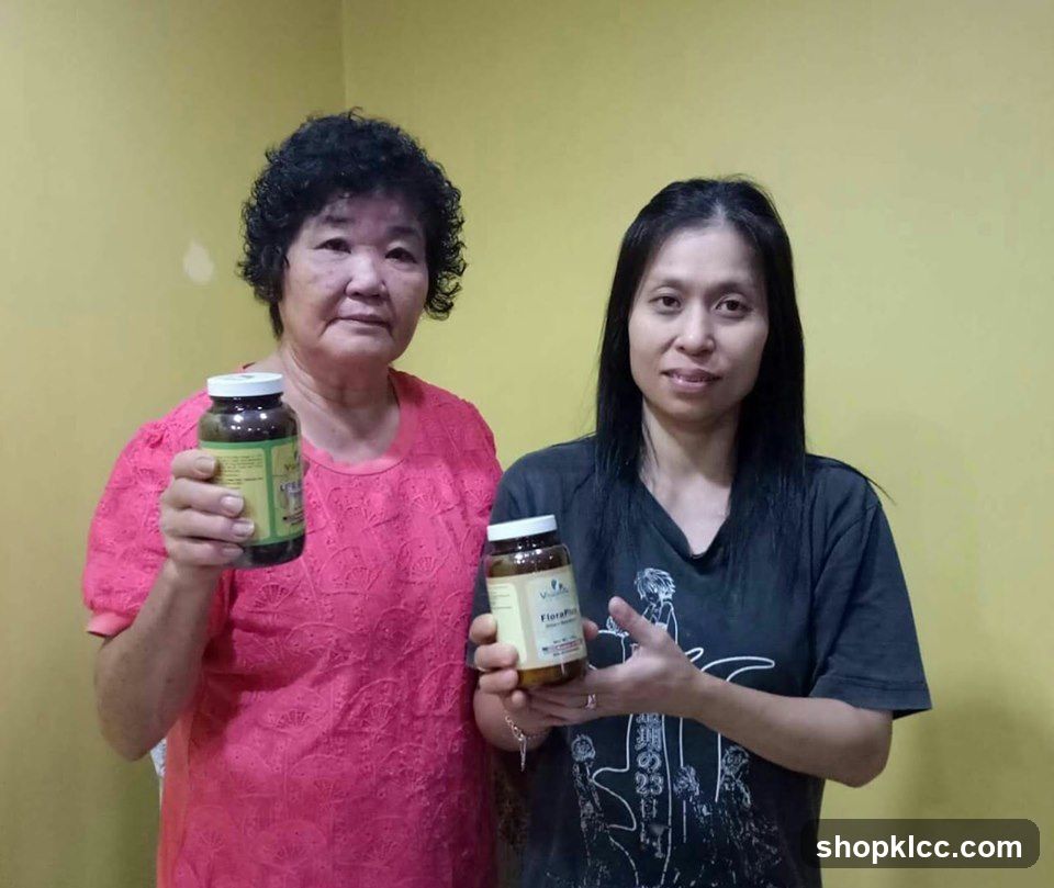 Two women holding supplement bottles
