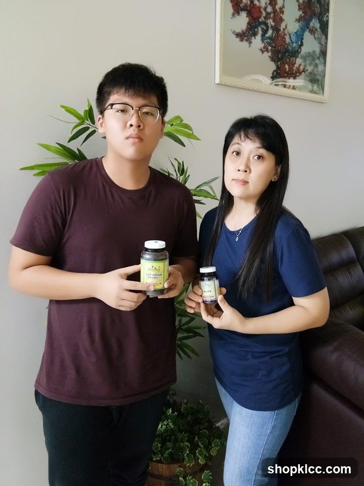 Two people holding supplement bottles