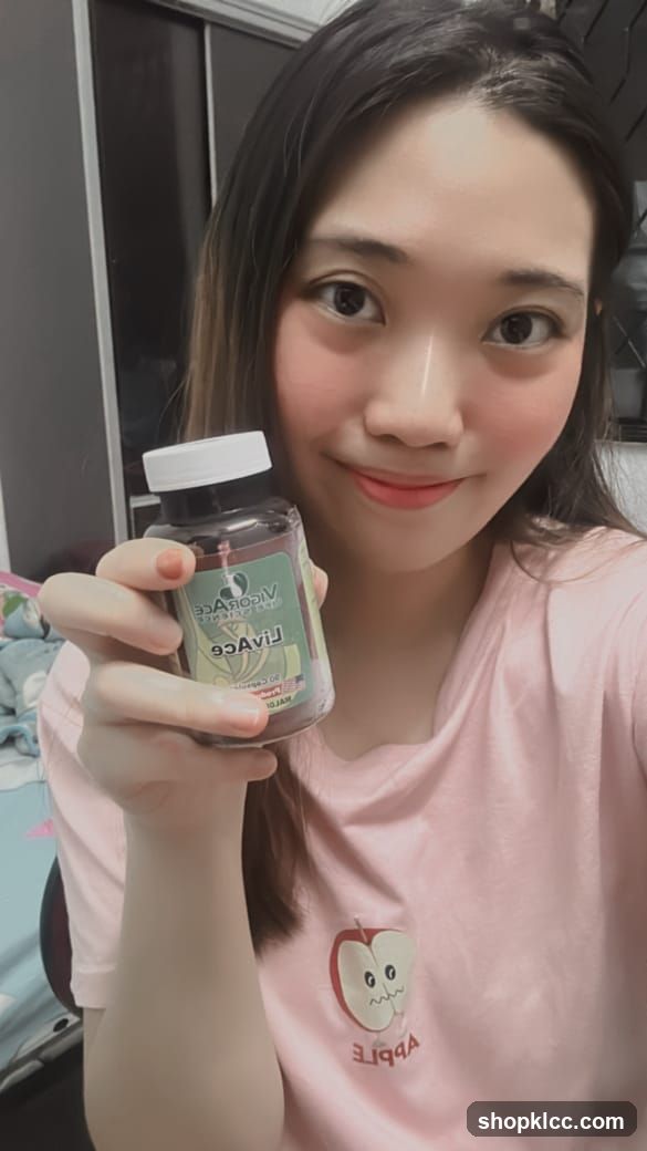 Woman holding a bottle of LivAce supplement
