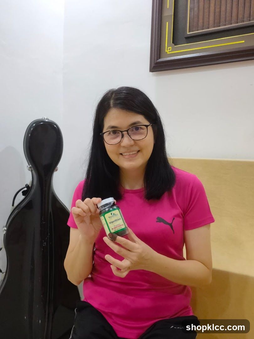 Woman holding a bottle of supplements