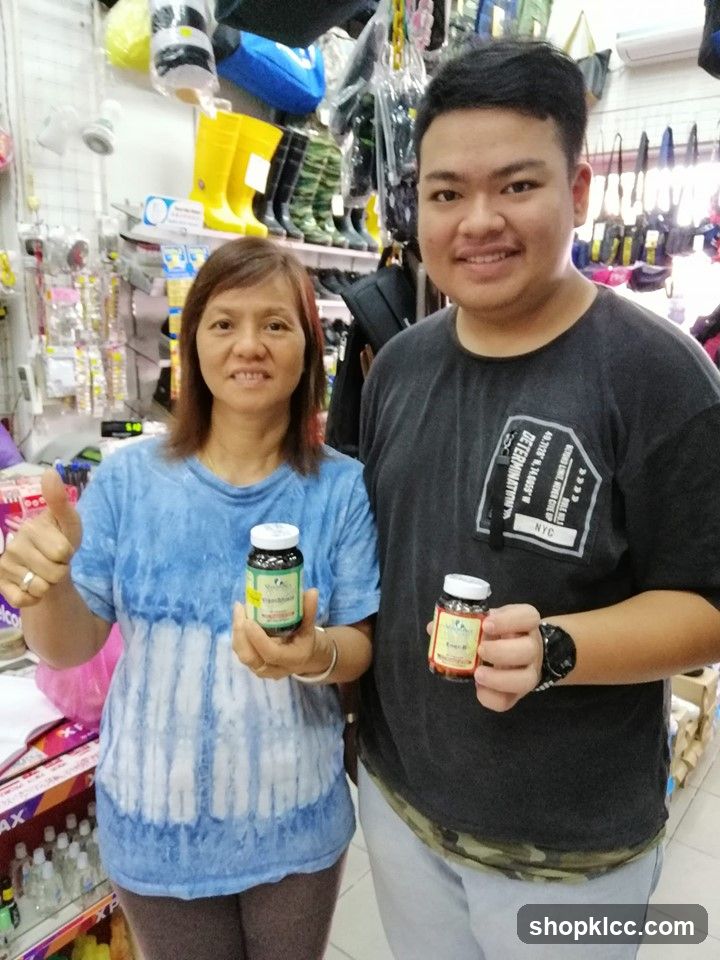 Two people holding bottles in a store
