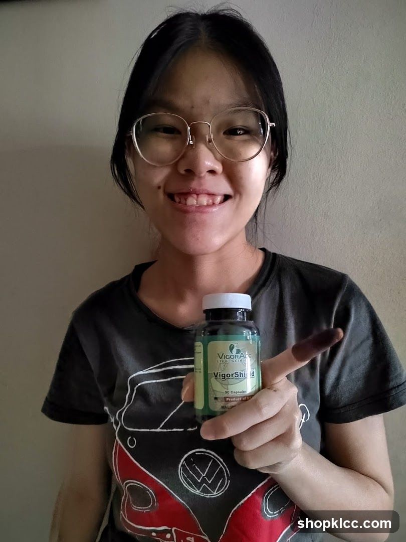 Person Holding Vitamin Bottle