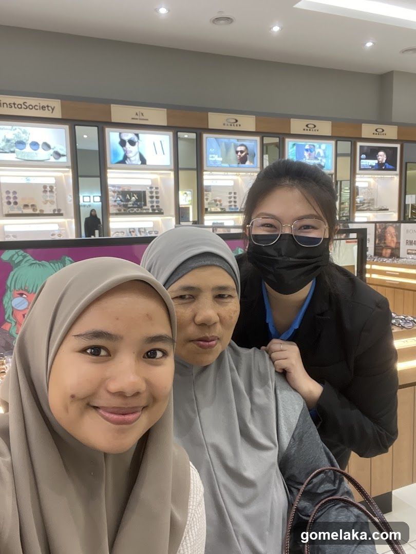 Group selfie in eyewear store