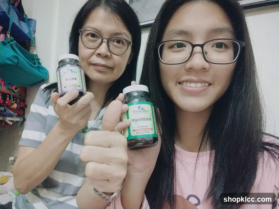 Two women holding supplement bottles