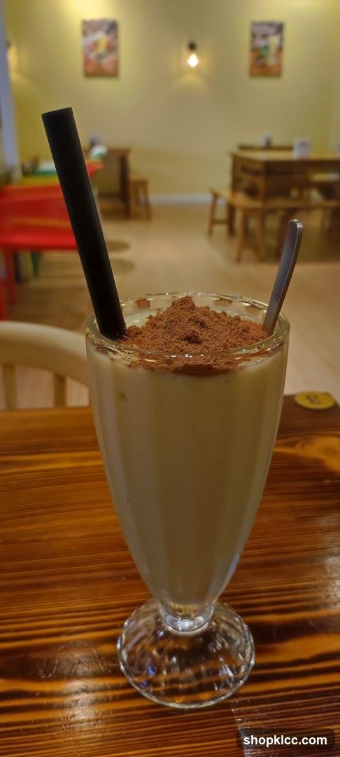 Cocoa Powder Milkshake with Straw and Spoon