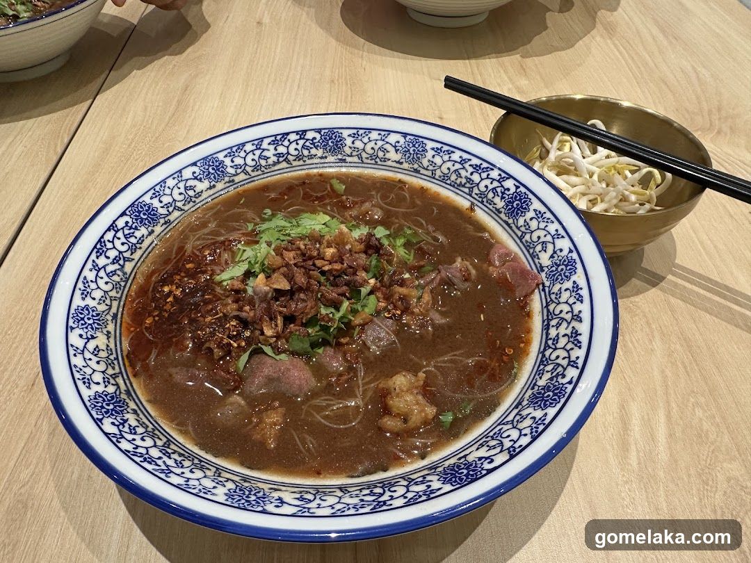 Bowl of noodle soup with garnish