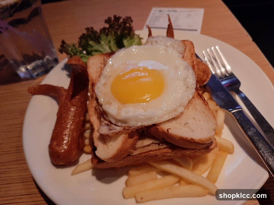 Fried Egg Sandwich with Fries and Sausage