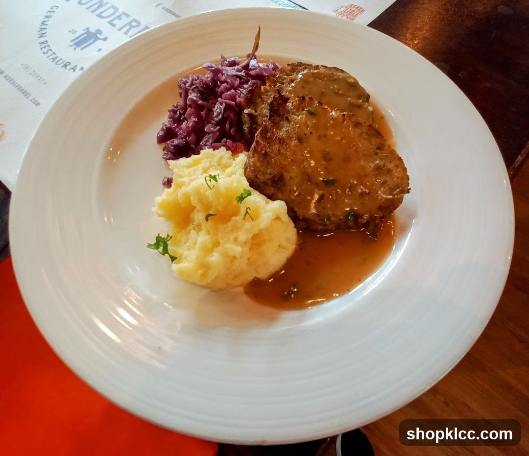 Plate of Meat with Red Cabbage and Mashed Potatoes