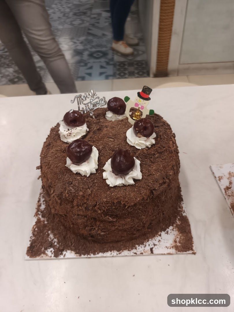 Chocolate Cake with Cherries and Snowman topper
