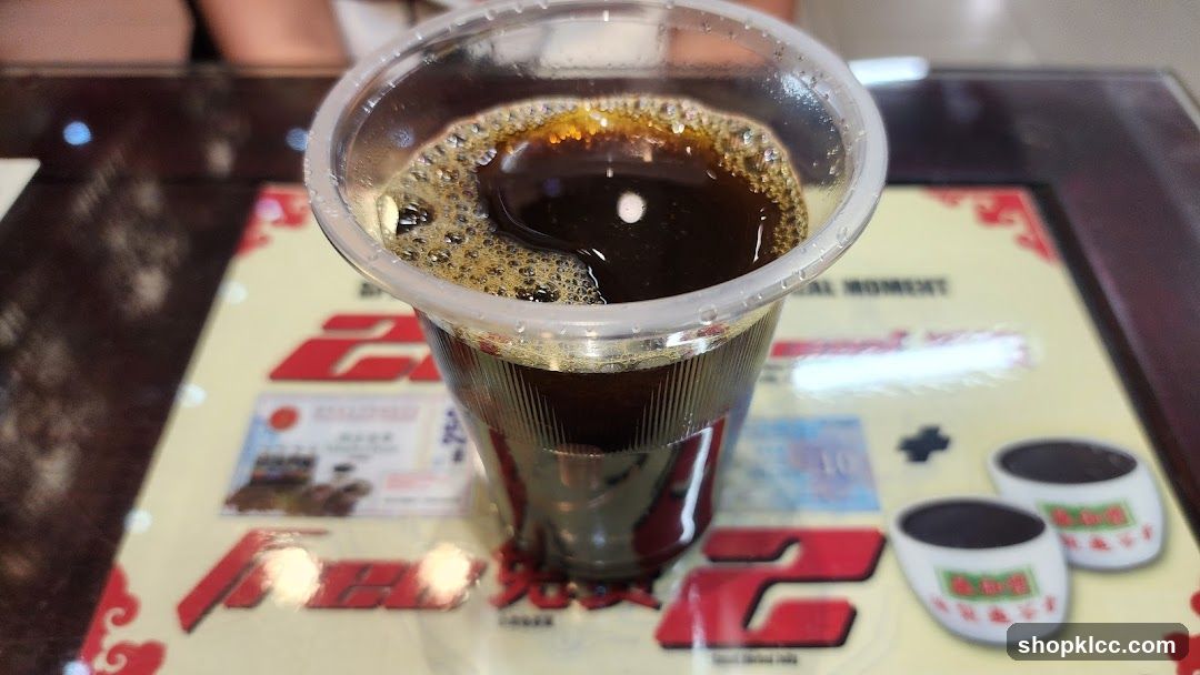 Coffee in plastic cup on table mat