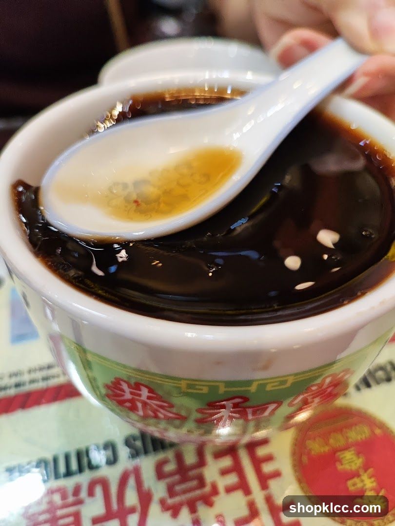 Bowl of dark dessert with spoon